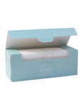Whistle Wellness 60-count triple-layer cotton face pads in an open blue box